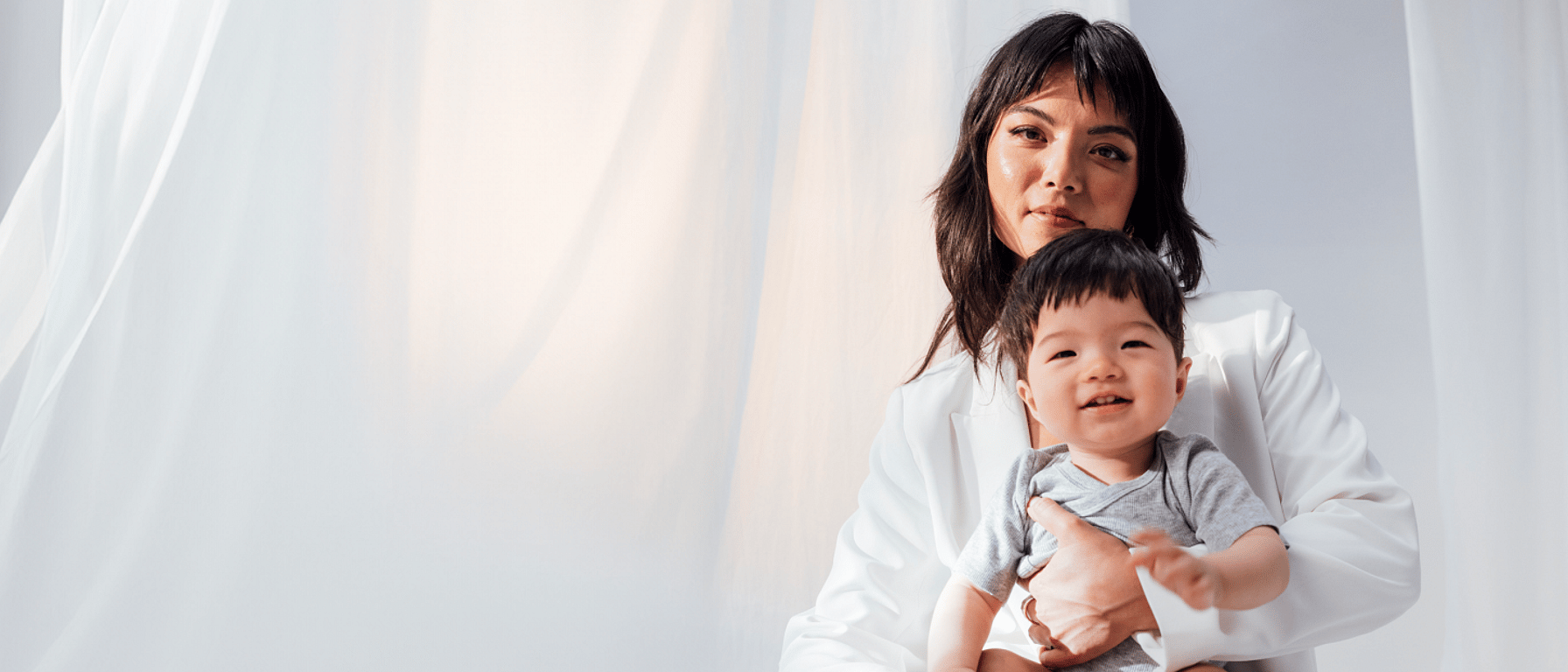 mother holds her baby in her arms