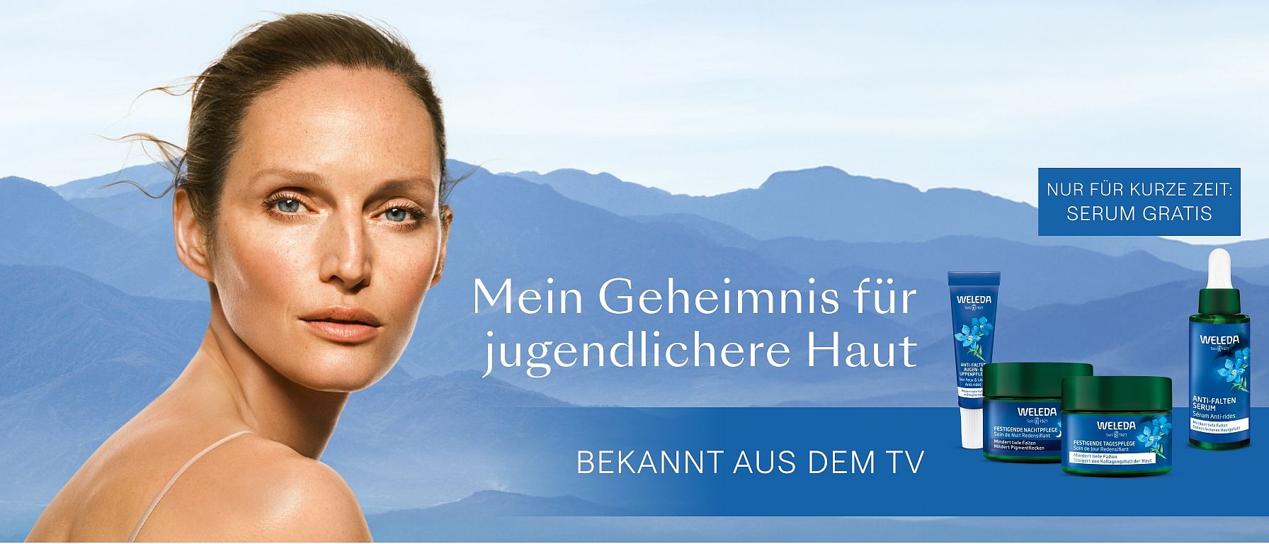 portrait of a woman in front of blue mountains